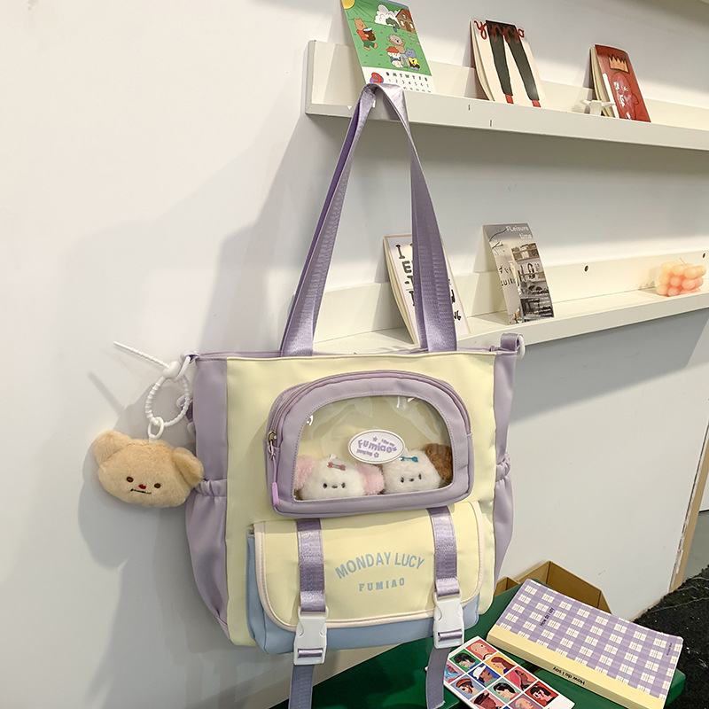Jauna multfilmu stila bērnu mugursoma, maza, svaiga, jauka, lielas ietilpības skolēnu plecu soma, kas paredzēta došanās uz nodarbībām un skolēnu somu