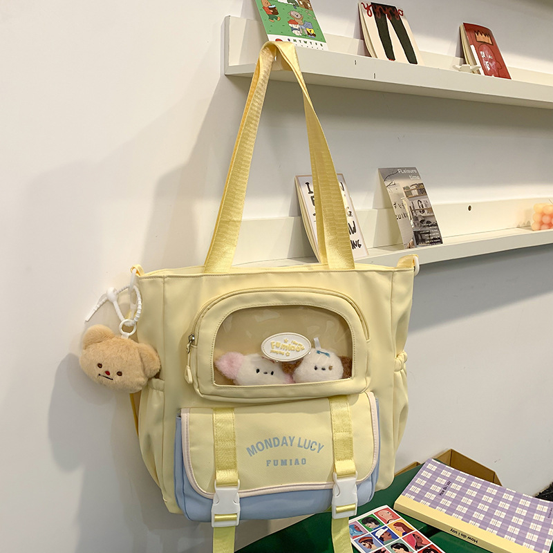 Jauna multfilmu stila bērnu mugursoma, maza, svaiga, jauka, lielas ietilpības skolēnu plecu soma, kas paredzēta došanās uz nodarbībām un skolēnu somu