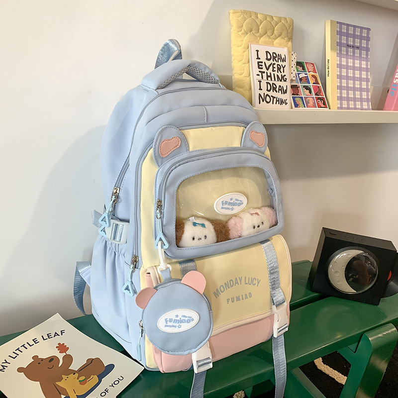 Jauna multfilmu stila bērnu mugursoma, maza, svaiga, jauka, lielas ietilpības skolēnu plecu soma, kas paredzēta došanās uz nodarbībām un skolēnu somu