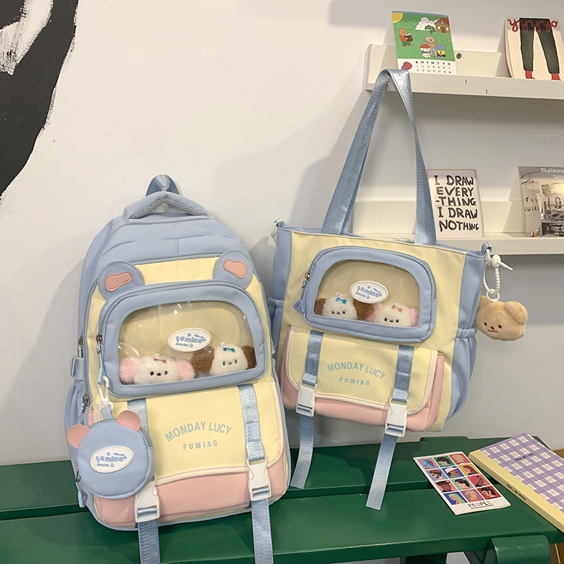 Jauna multfilmu stila bērnu mugursoma, maza, svaiga, jauka, lielas ietilpības skolēnu plecu soma, kas paredzēta došanās uz nodarbībām un skolēnu somu