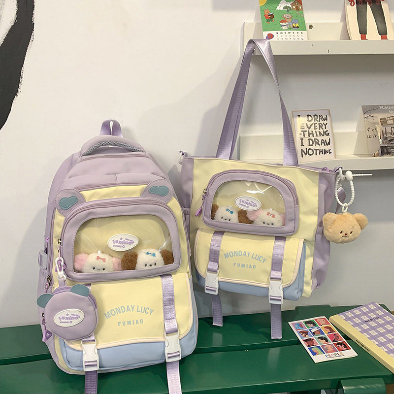 Jauna multfilmu stila bērnu mugursoma, maza, svaiga, jauka, lielas ietilpības skolēnu plecu soma, kas paredzēta došanās uz nodarbībām un skolēnu somu