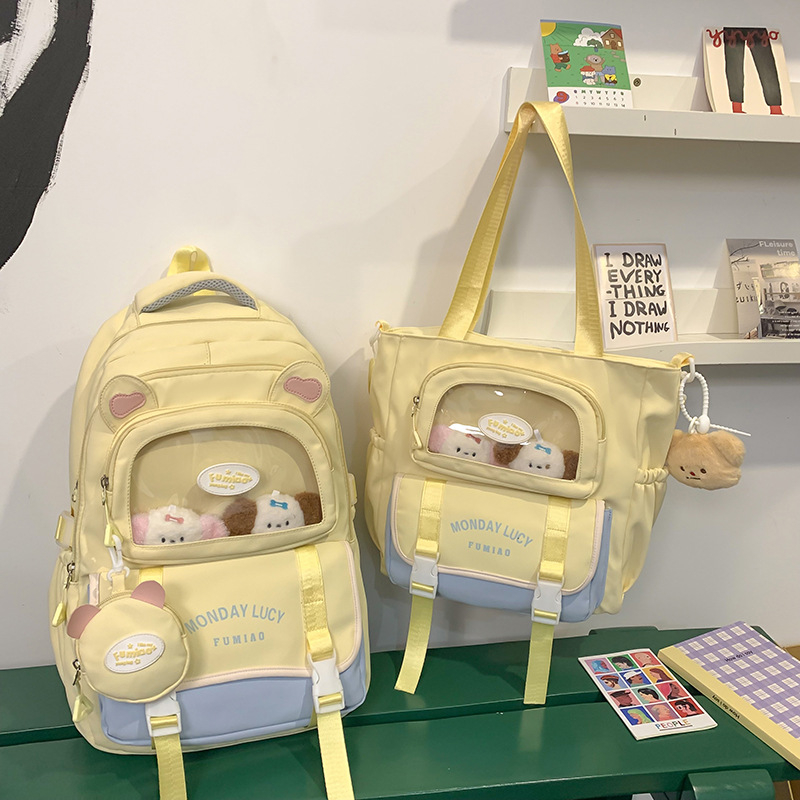 Jauna multfilmu stila bērnu mugursoma, maza, svaiga, jauka, lielas ietilpības skolēnu plecu soma, kas paredzēta došanās uz nodarbībām un skolēnu somu