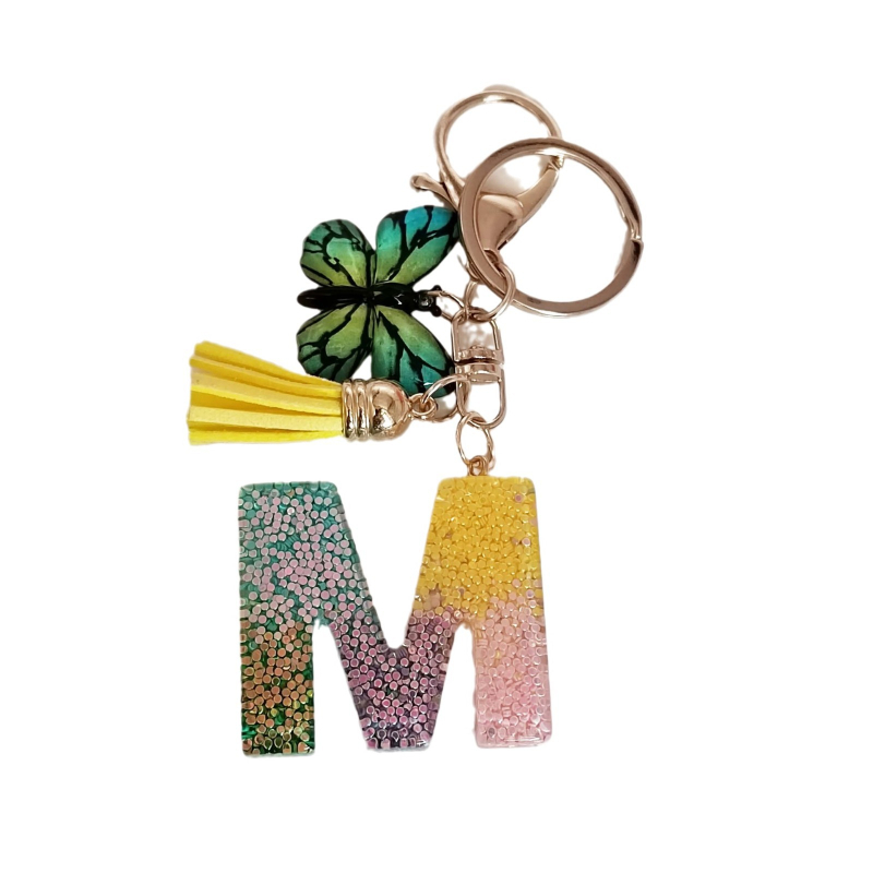 Ristäärisega 26 initsiaali vikerkaare järkjärgulise tutiga liblika ripatsiga võtmehoidja, litritega liimvaigust võtmehoidja