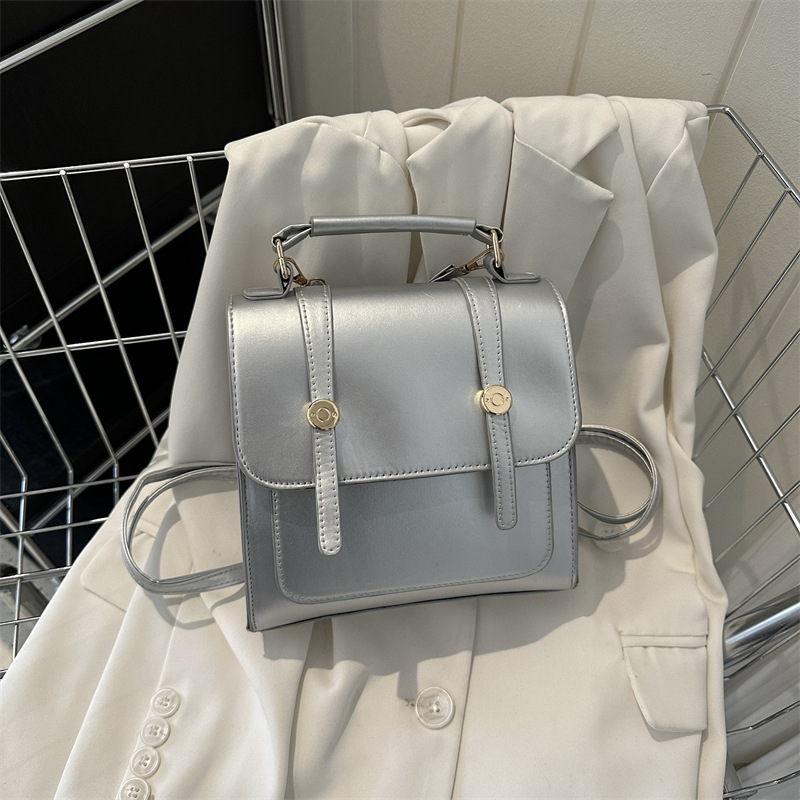 Vienkārša mugursoma sieviešu koledžas stila soma sieviešu soma 2023. gada jauna modes ikdienas plecu rokassoma maza mugursoma