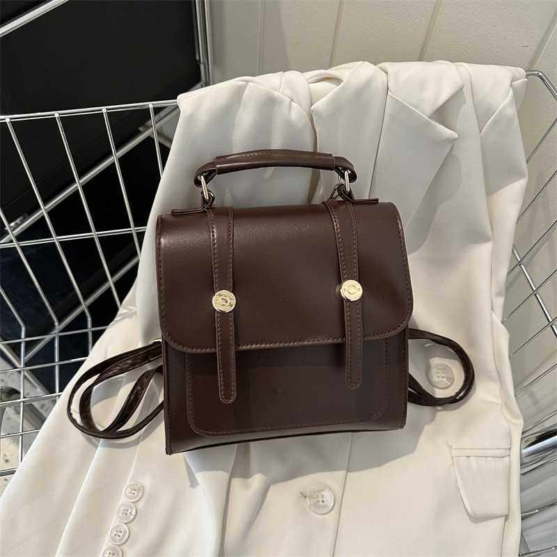 Vienkārša mugursoma sieviešu koledžas stila soma sieviešu soma 2023. gada jauna modes ikdienas plecu rokassoma maza mugursoma