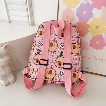 Moodne algkooli lastekott armas koomiksiga lasteaia väikese klassi tüdrukute suupistekott õues vaba aja veetmise seljakott