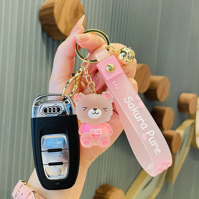 Koomiksiloominguline vaigust kristallkaru autovõtmehoidja ripats isikupärastatud nukukellaga koolikott väike kingitus hulgimüük