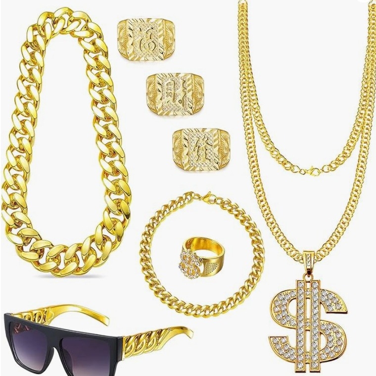 Europos ir Amerikos tarpvalstybinis hipių rokas, didelė žemė, turtinga aukso gaujos boso suknelė, perdėtai juokinga, turtingo dolerio karoliai, žiedas