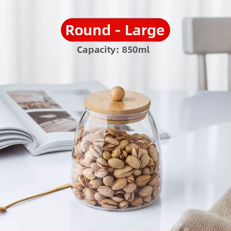 Skaidrus stiklinis arbatos indelis, kvapnus arbatos indelis, juodos arbatos buteliukas, apvalus bambukinis dangtelis su sandarinimo žiedu, prieskonių laikymo indelis