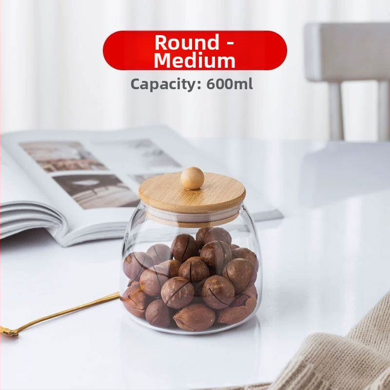 Skaidrus stiklinis arbatos indelis, kvapnus arbatos indelis, juodos arbatos buteliukas, apvalus bambukinis dangtelis su sandarinimo žiedu, prieskonių laikymo indelis