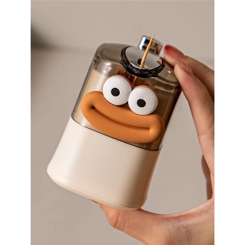 Animacinių filmukų dantų krapštukas Animacinių filmukų automatinis iššokantis namų apyvokos daiktų laikymas Didelės vertės kūrybinio kremo stiliaus naujas įrašas Prabangių restoranų dantų krapštukų dėžutė