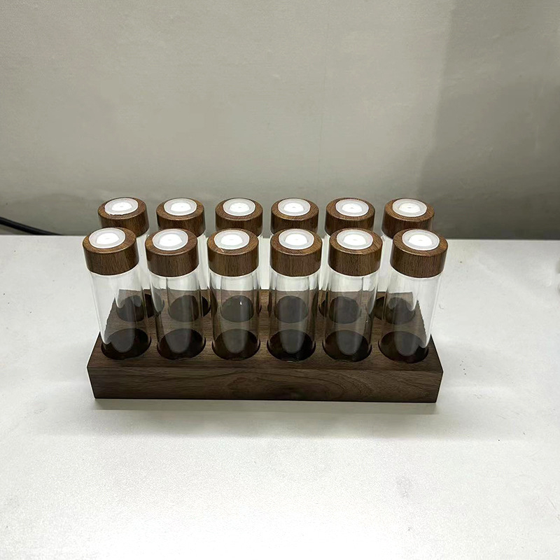 Kohvioad pakend katseklaas klaasist pähklipuust vitriin ühe toruga hoiustamiskoha kohvikomplekt suletud purgi lõhnapudel