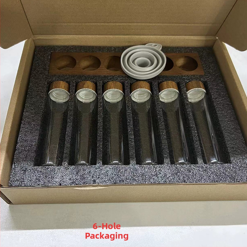 Kohvioad pakend katseklaas klaasist pähklipuust vitriin ühe toruga hoiustamiskoha kohvikomplekt suletud purgi lõhnapudel