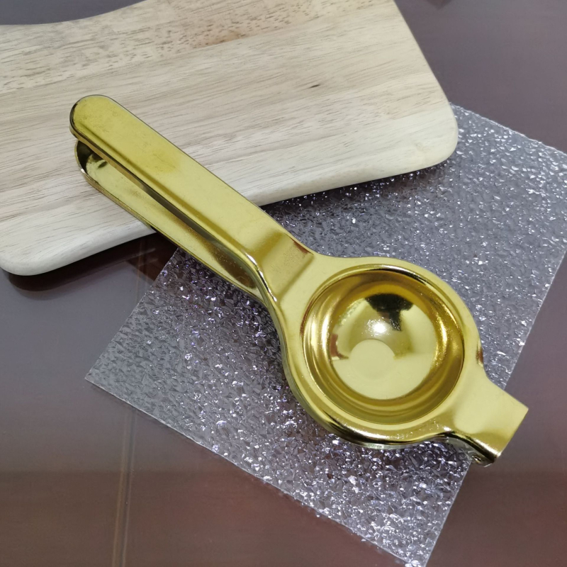 Kodumajapidamises kasutatav roostevabast terasest käsitsi pressitav sidrunimahlapress, köögis kasutatav kuldne roostevabast terasest puuviljamahlapress