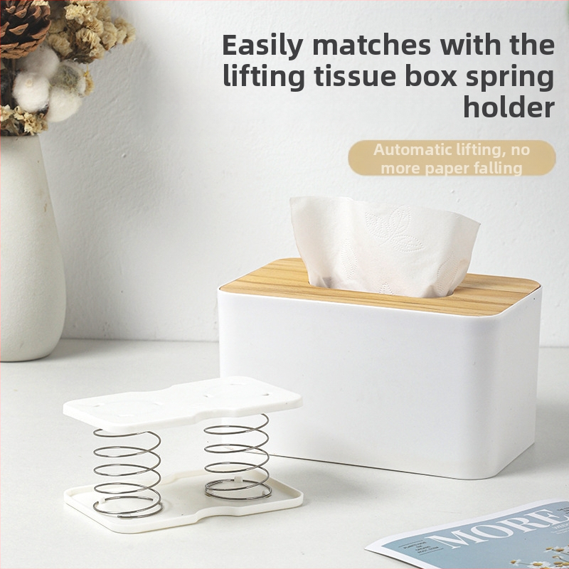 Pakeliama servetėlių dėžutės spyruoklinė atrama, skirta pritraukti prie apatinės spyruoklinės stalčiaus dėžutės apatinės atramos, laikymo dėžutės spyruoklinė lapo pakėlimo elastinė atrama