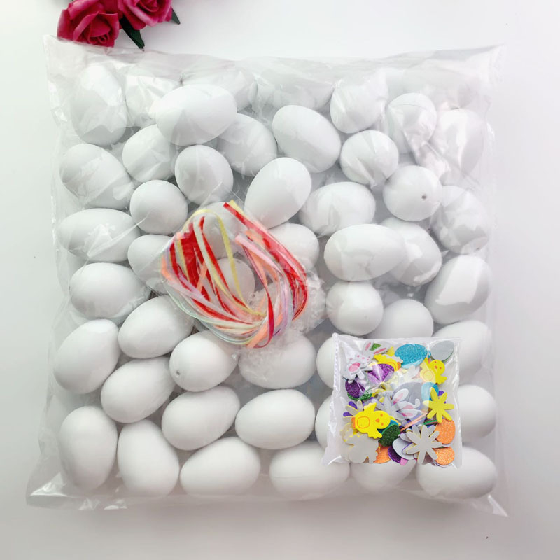 50 tükki valgeid värvilisi kunstmune, plastmassist munakoored, lasteaia käsitööna valminud graffiti lihavõttemunad