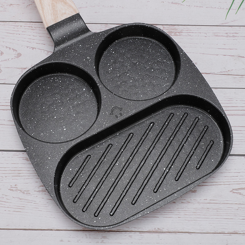 Kodumajapidamises praepann hommikusöögi munaburgeri pannkoogivorm nelja auguga praemunapann praemunaburgerimasin mittenakkuva panniga