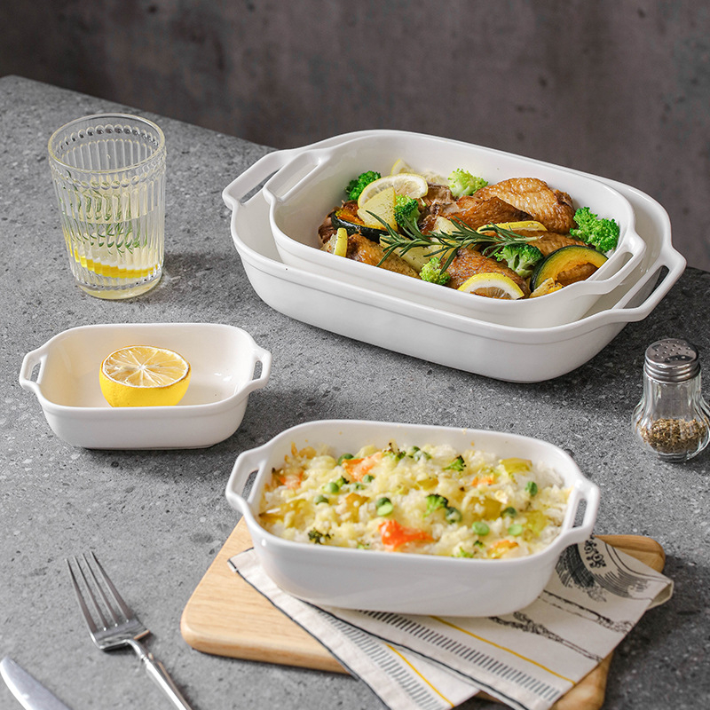 Vabaaja puhasvalge keraamiline ristkülikukujuline kahe kõrvaga küpsetuspann juustuga küpsetatud riisikauss kõrge temperatuurikindel majapidamisküpsetuskauss suupistekauss aurutatud kalataldrik