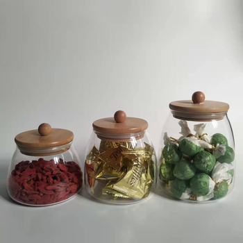 Tehase tarne Kõrgboorsilikaatklaasist suletud purk kuumakindlast klaasist bambusest kaanega teepurk kolmnurkne purk säilituspurk säilituspudel
