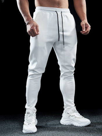 Sügise ja talve meeste spordi- ja vabaaja venivad jooksupüksid, kiiresti kuivavad, hingavad, õues kasutamiseks mõeldud treeningpüksid, õhukese lõikega jalapüksid