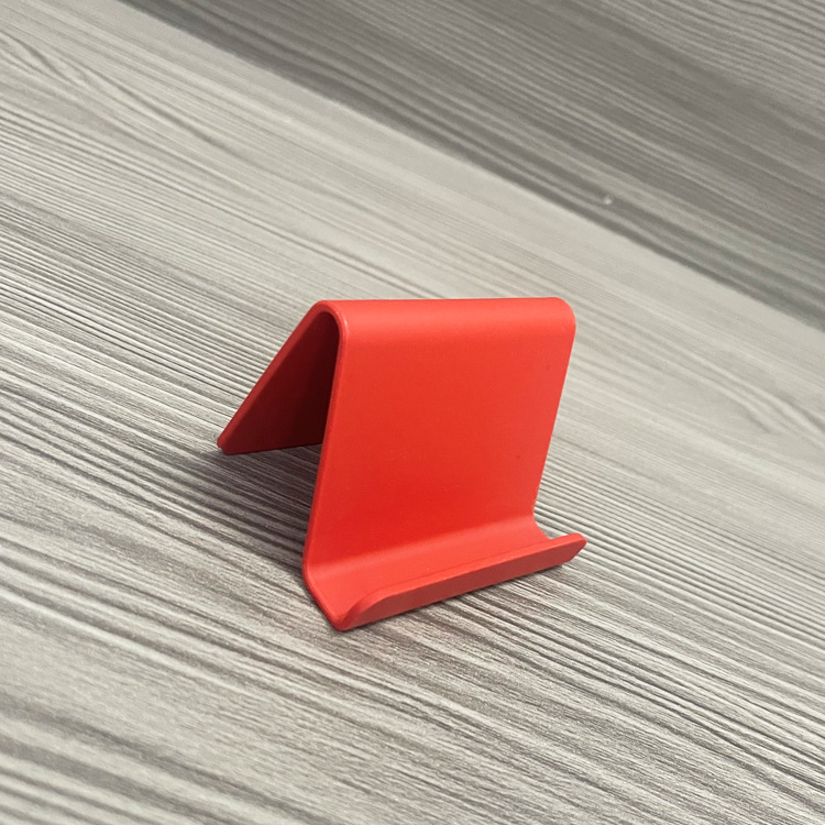 „Ditui“ dovanų reklaminis mobiliojo telefono laikiklis su spausdintu logotipu ir tekstu. Paprastas nešiojamas stalinis mobiliojo telefono laikiklis, didmeninė prekyba.