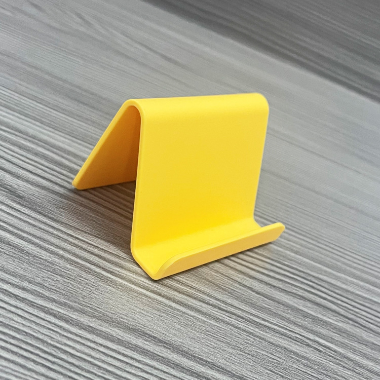 „Ditui“ dovanų reklaminis mobiliojo telefono laikiklis su spausdintu logotipu ir tekstu. Paprastas nešiojamas stalinis mobiliojo telefono laikiklis, didmeninė prekyba.