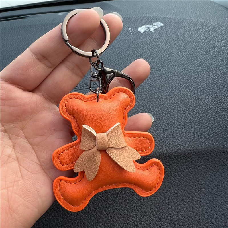 Kreatív ajándék bőr masni medvés autós kulcstartó táska medál aranyos autós kulcstartó gyűrű medál