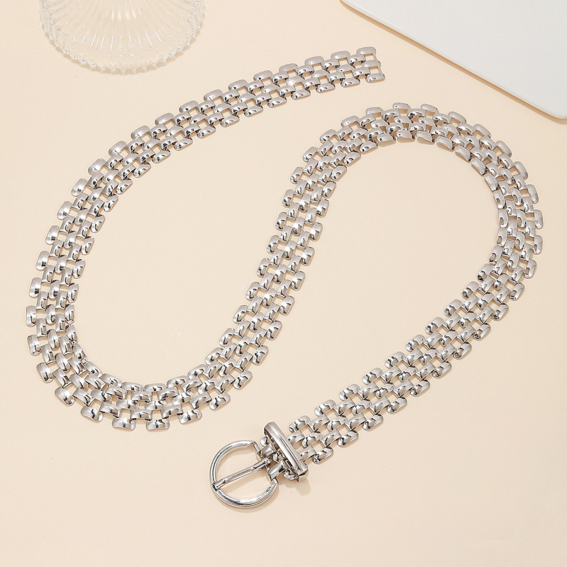 Europos ir Amerikos mados užsienio prekybos metalinis diržas. Universalus madingas aukščiausios klasės kostiumas su metaline meliono sėklų grandinėle.