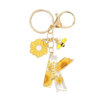 Μικρό μπρελόκ με γράμμα μαργαρίτας σε διασυνοριακές εκρήξεις, νέο μπρελόκ με φούντα, κίτρινο χρυσάνθεμο, αποξηραμένο λουλούδι, σχολική τσάντα
