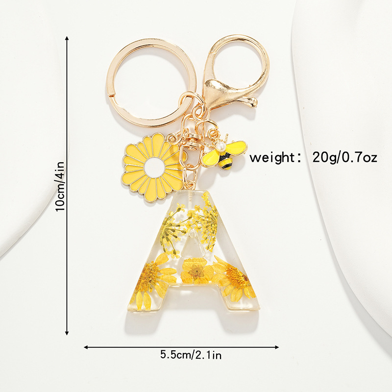 Raktų pakabukas su maža ramunėlių raide, naujas, kutais, geltona chrizantema, džiovinta gėlė, raktų pakabukas, mokyklinė kuprinė