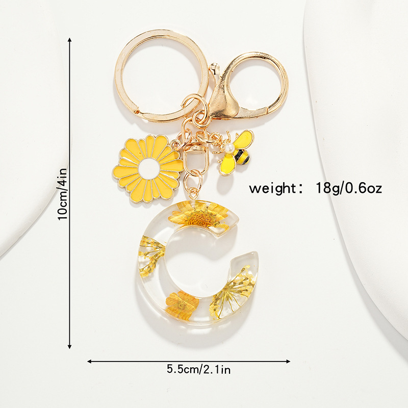 Raktų pakabukas su maža ramunėlių raide, naujas, kutais, geltona chrizantema, džiovinta gėlė, raktų pakabukas, mokyklinė kuprinė