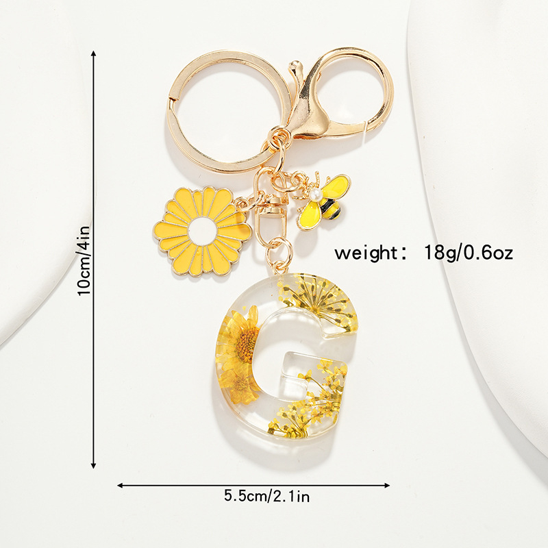 Raktų pakabukas su maža ramunėlių raide, naujas, kutais, geltona chrizantema, džiovinta gėlė, raktų pakabukas, mokyklinė kuprinė