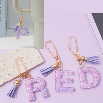 26 angliškų raidžių violetinis kutais ir žvaigždėmis puoštas blizgučiais moteriškas krepšys su vandens puodelio grandinėle, automobilio raktų pakabukas su kryželiu