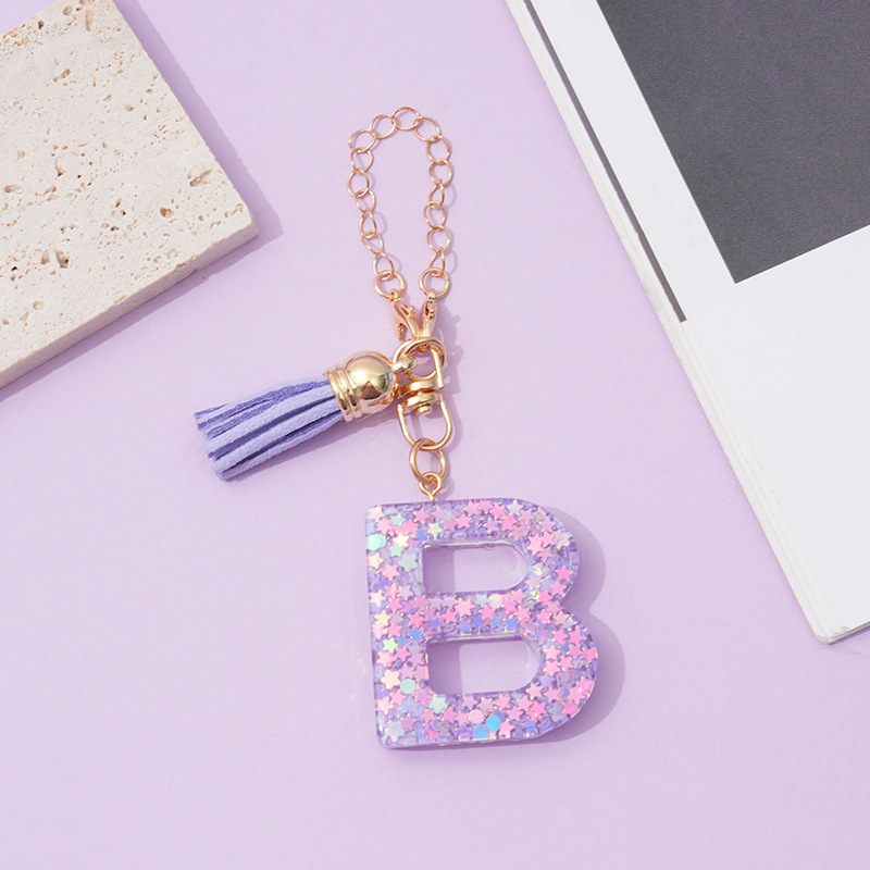 26 angliškų raidžių violetinis kutais ir žvaigždėmis puoštas blizgučiais moteriškas krepšys su vandens puodelio grandinėle, automobilio raktų pakabukas su kryželiu