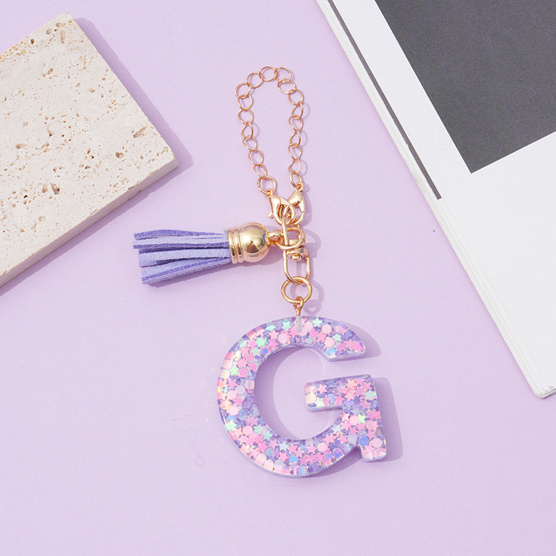 26 angliškų raidžių violetinis kutais ir žvaigždėmis puoštas blizgučiais moteriškas krepšys su vandens puodelio grandinėle, automobilio raktų pakabukas su kryželiu