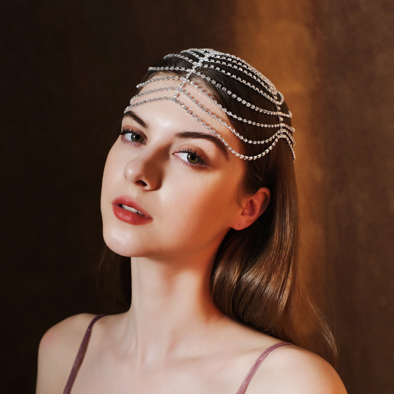 Euroopa ja Ameerika moe isiksuse palliga juukseaksessuaarid, kerged luksuslikud rhinestone`i kulmude ripatsiga juuksepaelad, liialdatud mitmekihilised virnastatud moekad juukseketid