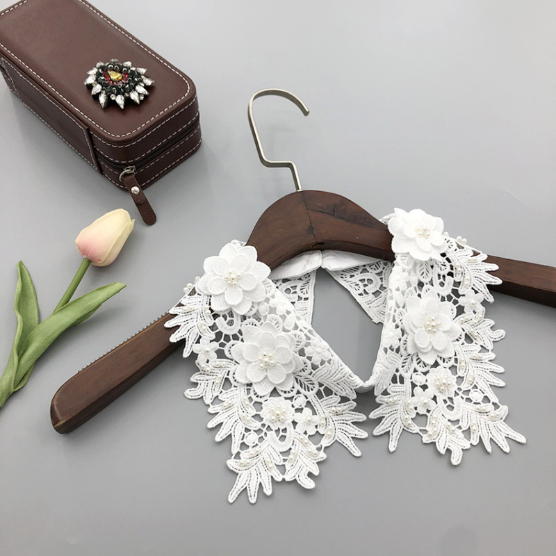 Mūsų gamykla gamina smėlyje tirpius siuvinėjimus ir trimačius mažų gėlių imitacinius antkaklius, gamykloje yra visų rūšių imitacinių antkaklių drabužių aksesuarų.