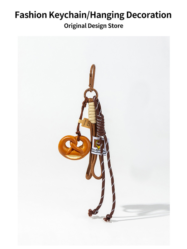 „Maillard Brown“ korėjietiško stiliaus šokoladinis riestainis su šarminiu mazgu, dekoratyvinė grandinėlė su „Miu“ šarminės duonos pakabuku