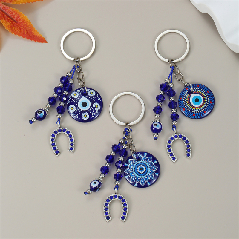 Piiriülene võtmehoidja, kuradisilma lehed, liblikas, piiriülene ehe, loominguline võtmehoidja, sinine silmakott, ripats