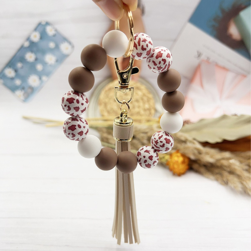 2024 Amazon új színes leopárd gyöngyös karkötő kulcstartó női színes gyöngyös karkötő bojtos medál