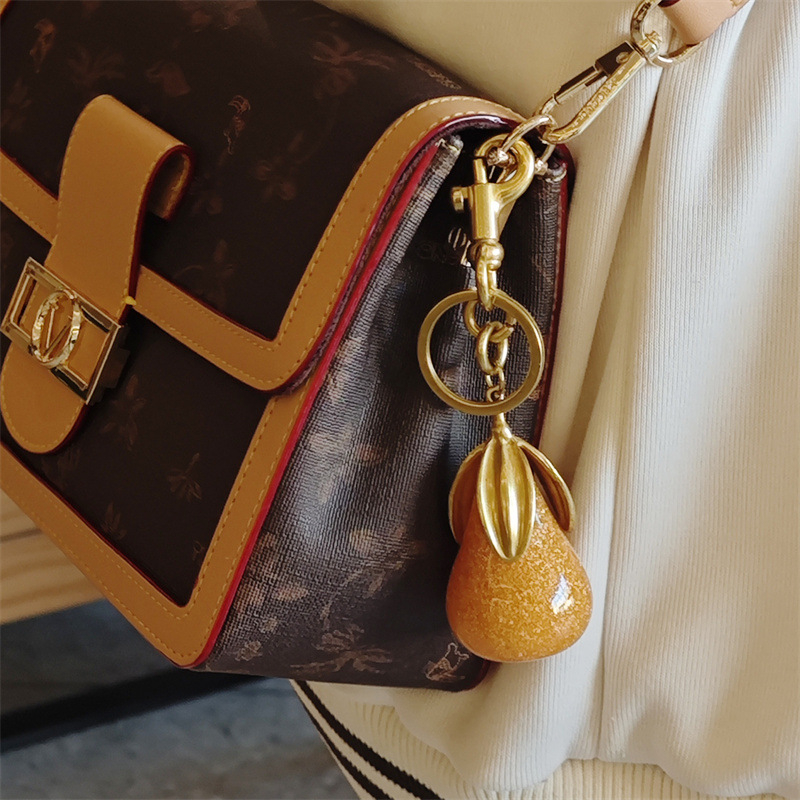 Gamyklinis tiesioginis aukso kriaušės raktų pakabuko pakabukas, mados asmenybės krepšys, pakabukas, raktų žiedo aksesuarai