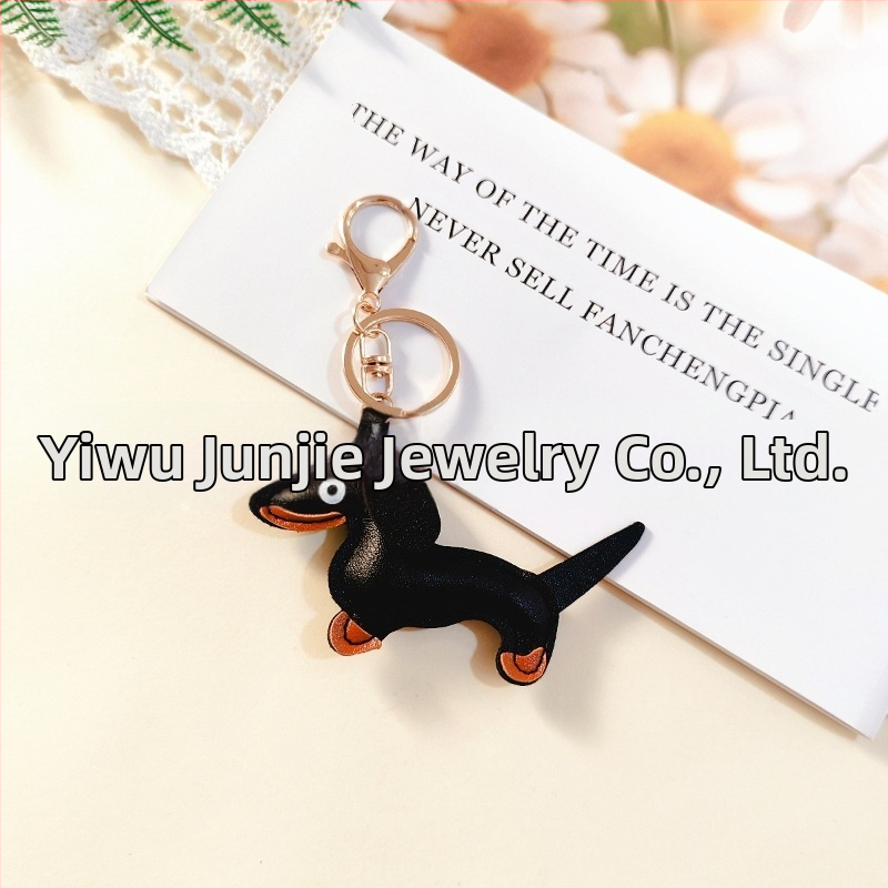 Határokon átnyúló Amazon új PU tacskó kutya kulcstartó kézi kötél táska függő baba kézitáska dekoratív bőr medál Tide