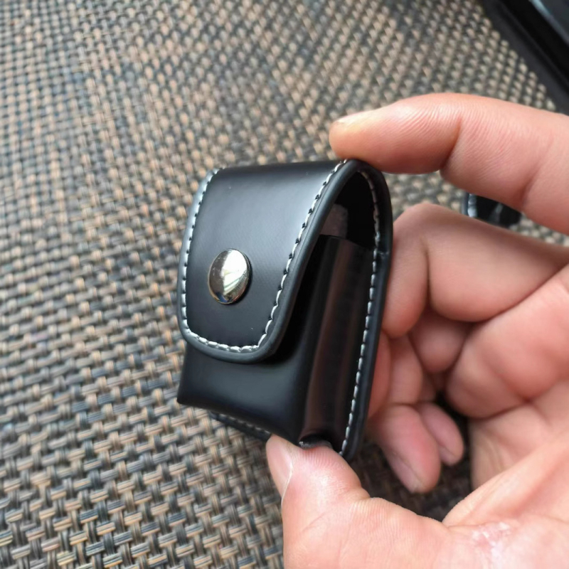 Äri kaasaskantav tulemasin nahkümbris rippuv vööle kinnitatav nahast tulemasina hoiukott ärikingituseks ülikonna nahkümbris