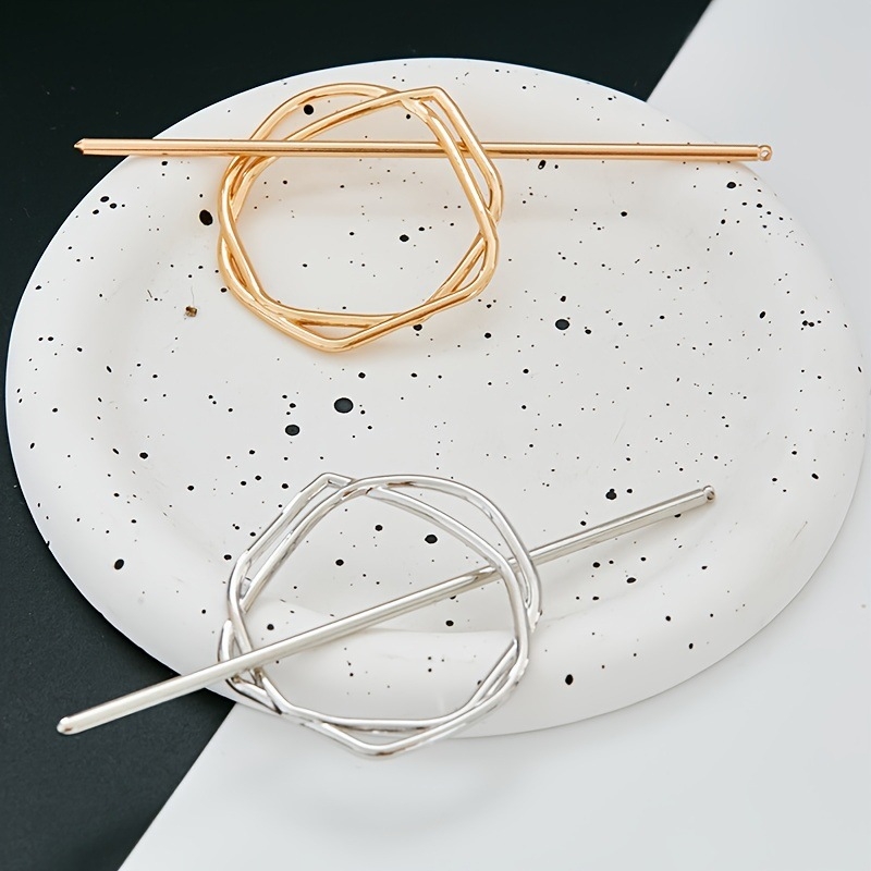 Nauji, paprasti, netaisyklingi, ilgų plaukų segtukai, dvigubos šakutės, lygios metalinės, apvalios.