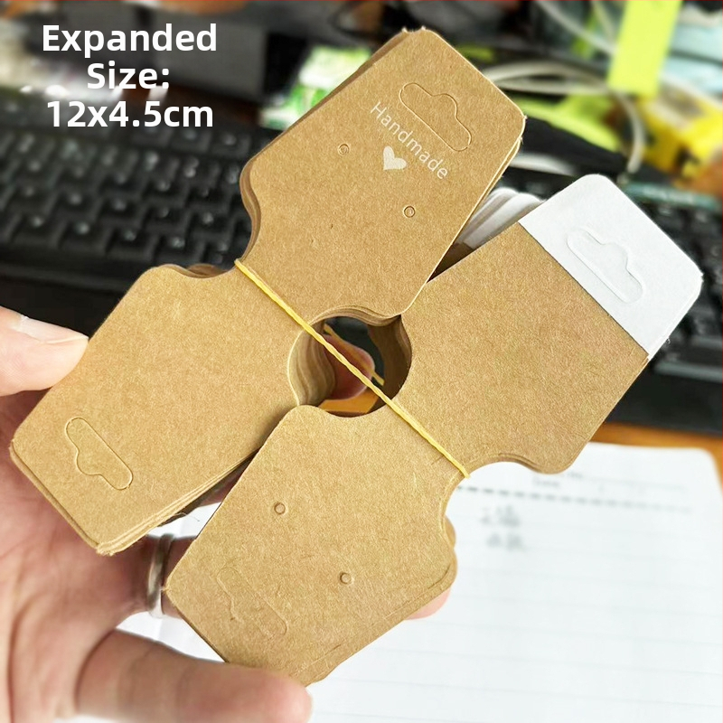 Papuošalų kortelė, perlenkta per pusę su lipnia kortele, lipni „Liftas Love“ rankų darbo papuošalų demonstravimo kortelė, skirta tarpvalstybiniam sprogimui, yra sandėlyje.