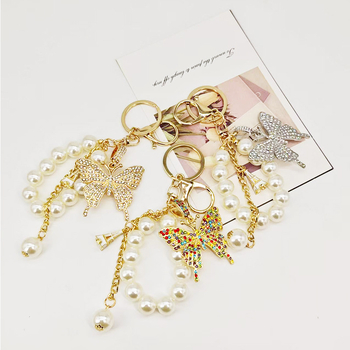 Új gyöngyláncos kulcstartó ötvözetből készült pillangós kulcstartó, gyönyörű autós kulcstartó táska, gyönyörű koreai dekoráció