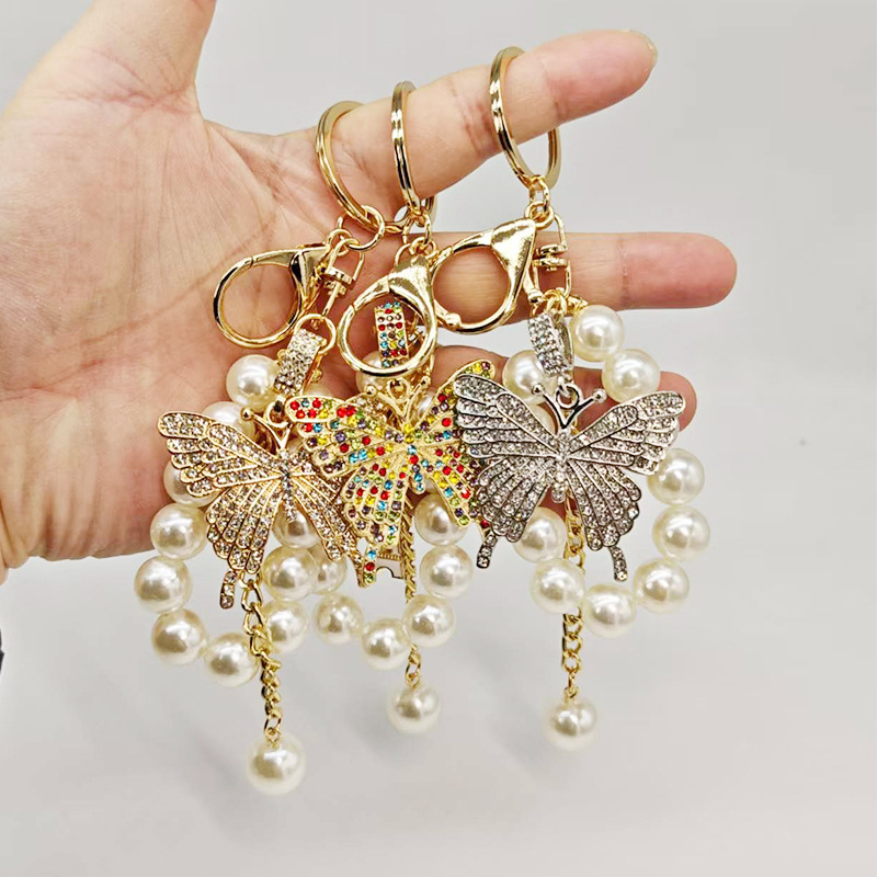 Új gyöngyláncos kulcstartó ötvözetből készült pillangós kulcstartó, gyönyörű autós kulcstartó táska, gyönyörű koreai dekoráció