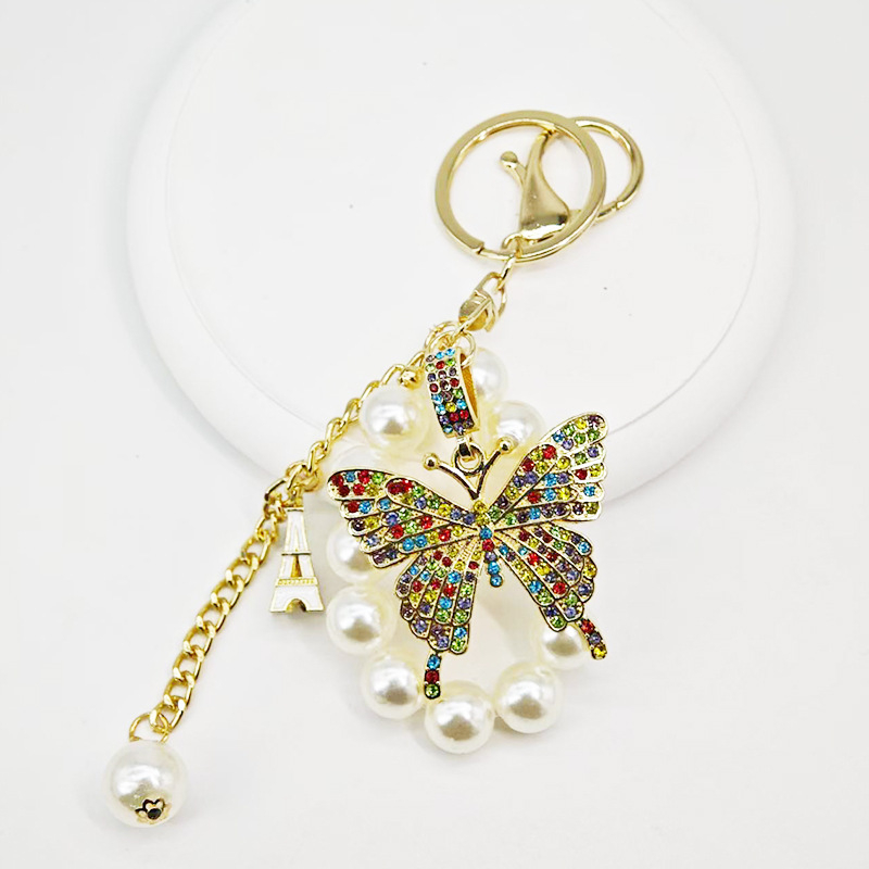 Új gyöngyláncos kulcstartó ötvözetből készült pillangós kulcstartó, gyönyörű autós kulcstartó táska, gyönyörű koreai dekoráció