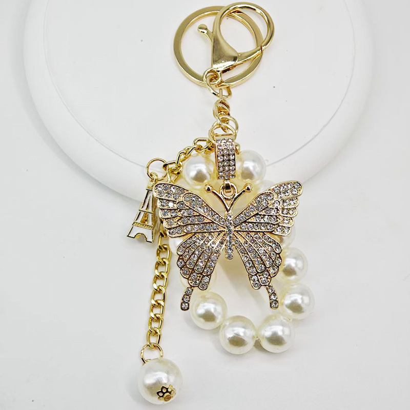 Új gyöngyláncos kulcstartó ötvözetből készült pillangós kulcstartó, gyönyörű autós kulcstartó táska, gyönyörű koreai dekoráció