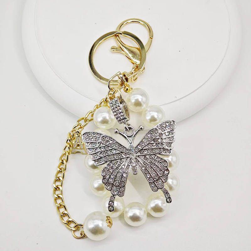 Új gyöngyláncos kulcstartó ötvözetből készült pillangós kulcstartó, gyönyörű autós kulcstartó táska, gyönyörű koreai dekoráció